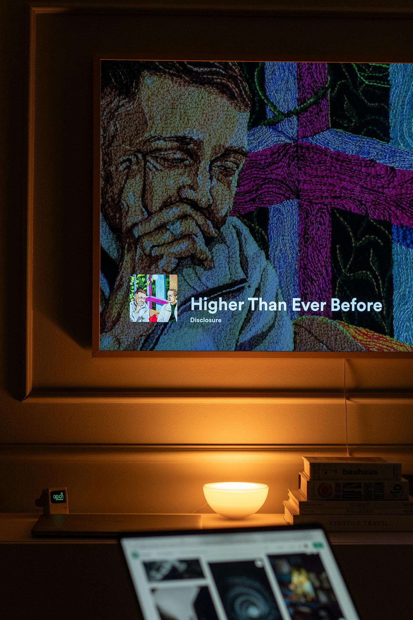 A warm indoor setting with a TV displaying music. Perfect evening ambiance.